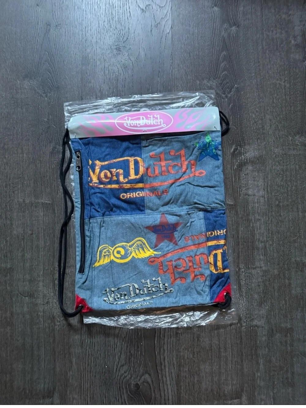 Von Dutch Patchwork Denim Logo Drawstring Backpack in Blue and Red Accents